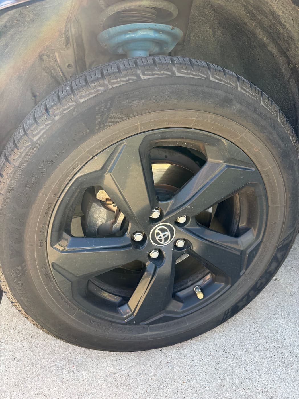 Clean black Toyota alloy wheel and dressed tire